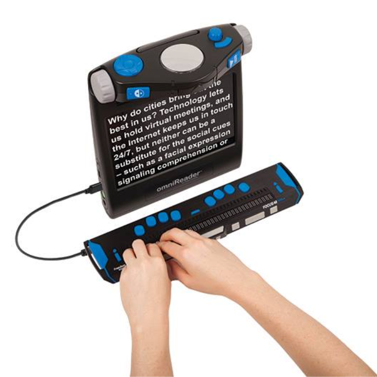 Focus 40 Braille Display plugged into the Omnireader® with both hands touching pins